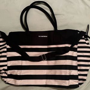 Striped Victoria’s Secret duffel bag with shoulder strap